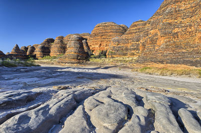 Rock formation against clear blue sky