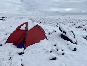 Tent on snow covered field