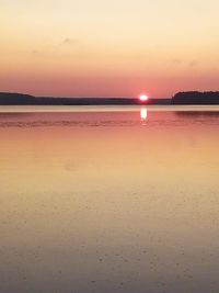 Scenic view of sea against romantic sky at sunset