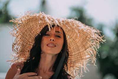 Portrait of young woman wearing hat