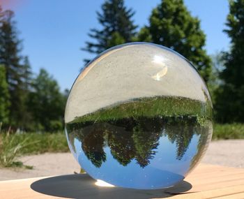 Close-up of crystal ball against clear sky