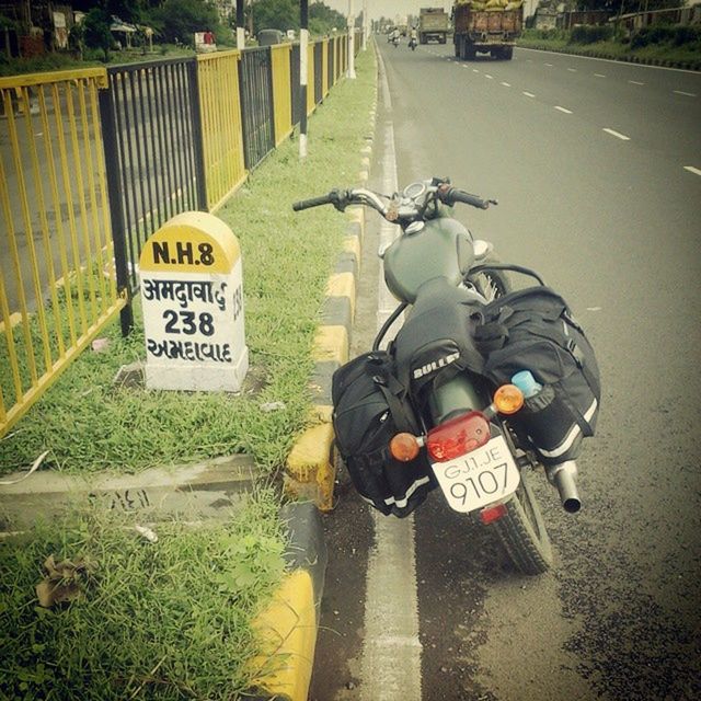 transportation, road, road marking, guidance, the way forward, communication, road sign, high angle view, street, text, asphalt, sign, safety, western script, land vehicle, direction, information sign, arrow symbol, day, mode of transport