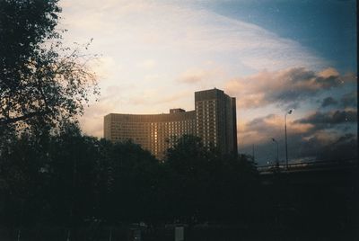 Silhouette buildings against sky during sunset