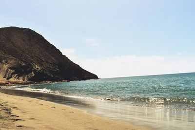 Scenic view of beach against sky