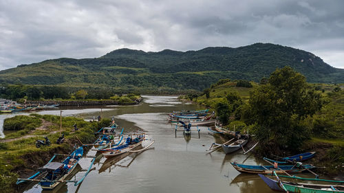 High angle view of river amidst trees against sky