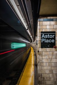 Blurred motion of train at railroad station