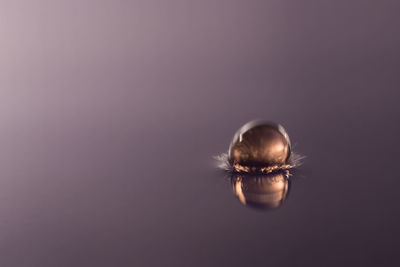 Close-up of sphere against purple background