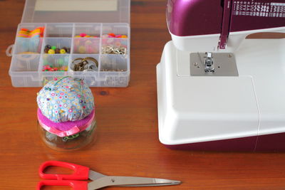 High angle view of sewing items on table