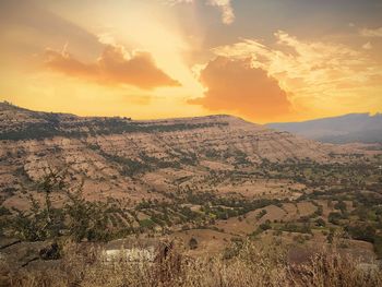 Scenic view of landscape against sky during sunset