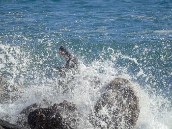 Scenic view of sea waves splashing on shore