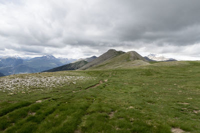 Scenic view of landscape and mountains against sky