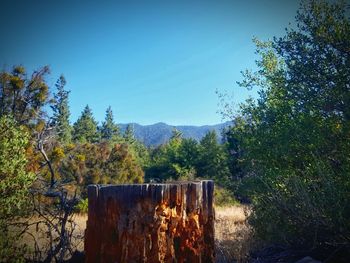 Scenic view of mountains against clear blue sky