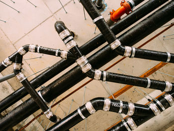 Pipes against brick wall in industry