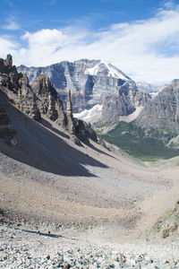 Scenic view of mountains against cloudy sky