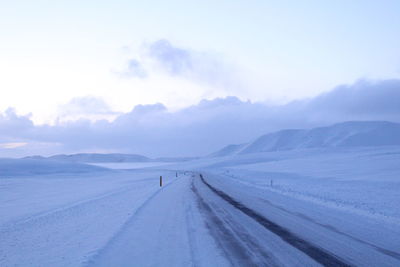 Scenic view of landscape against sky during winter