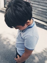 High angle view of boy looking at camera