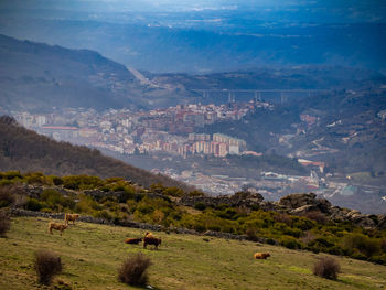 High angle view of landscape and mountains against sky