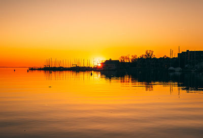 Scenic view of sea against orange sky