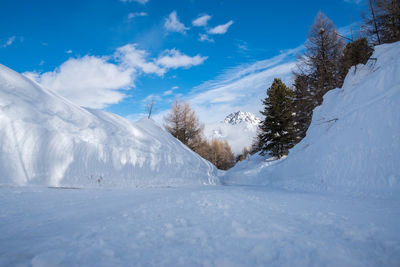 Snowcapped landscape against sky