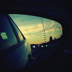 Car on road at sunset