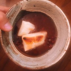 Close-up of cropped hand holding drink