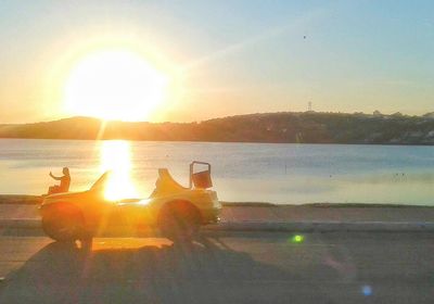 Scenic view of sunset over lake