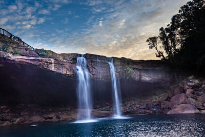 Waterfall streams falling from mountain top at morning long exposure shot from different angle