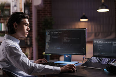 Young man using laptop at home