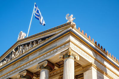 Low angle view of building against blue sky