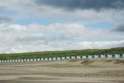 Scenic view of landscape against cloudy sky