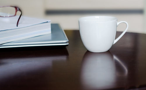 Close-up of coffee cup on table