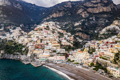 High angle view of townscape by sea