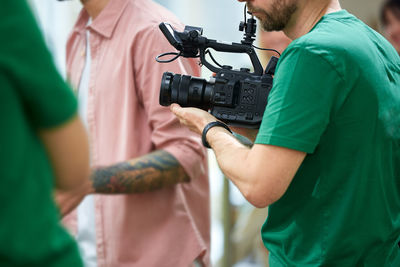 Midsection of man photographing