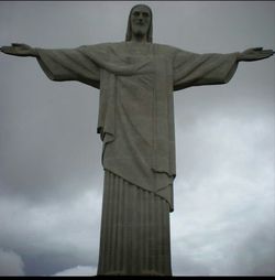 Low angle view of statue against cloudy sky