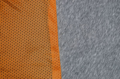 Full frame shot of orange and gray textiles