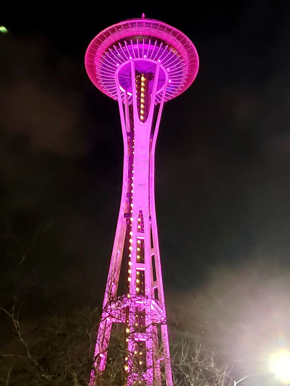 LOW ANGLE VIEW OF ILLUMINATED FERRIS WHEEL AGAINST SKY