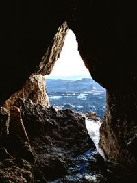 Scenic view of sea seen through cave