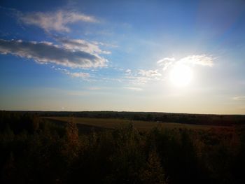 Scenic view of field against sky during sunset