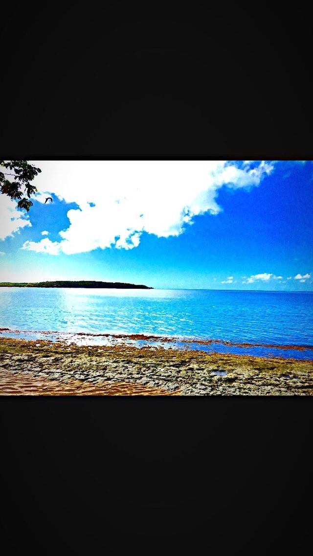 sea, water, scenics, blue, sky, tranquil scene, horizon over water, tranquility, beach, beauty in nature, cloud - sky, nature, idyllic, calm, cloud, shore, outdoors, day, non-urban scene, vacations, coastline, no people, seascape, tourism, remote