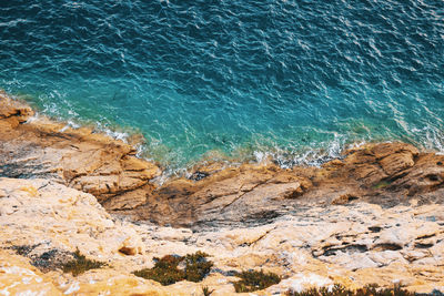 High angle view of rocks on beach