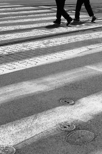 Low section of man standing on water
