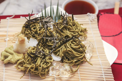 Cold noodles topped with seaweed vegan food on the table