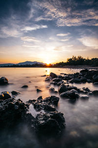 Scenic view of sea against sky during sunrise