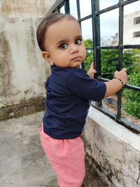 Portrait of cute boy standing outdoors