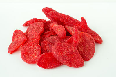 Close-up of red cake against white background