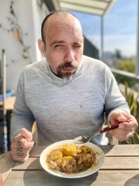 Portrait of man holding food