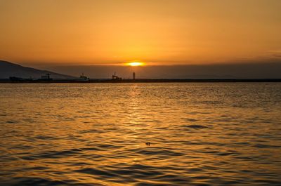 Scenic view of sea at sunset