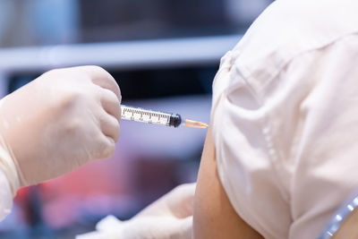 Midsection of person holding ice cream