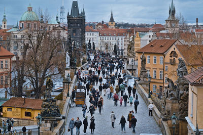 Group of people in front of buildings in town