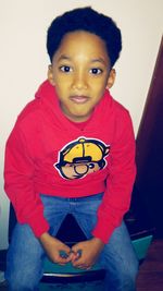 Portrait of smiling girl holding camera